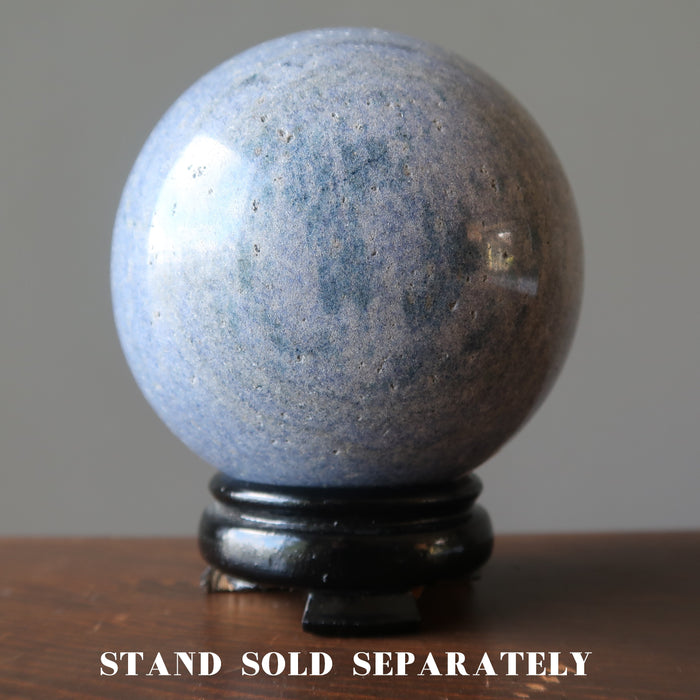 blue aventurine sphere on a wood display stand 