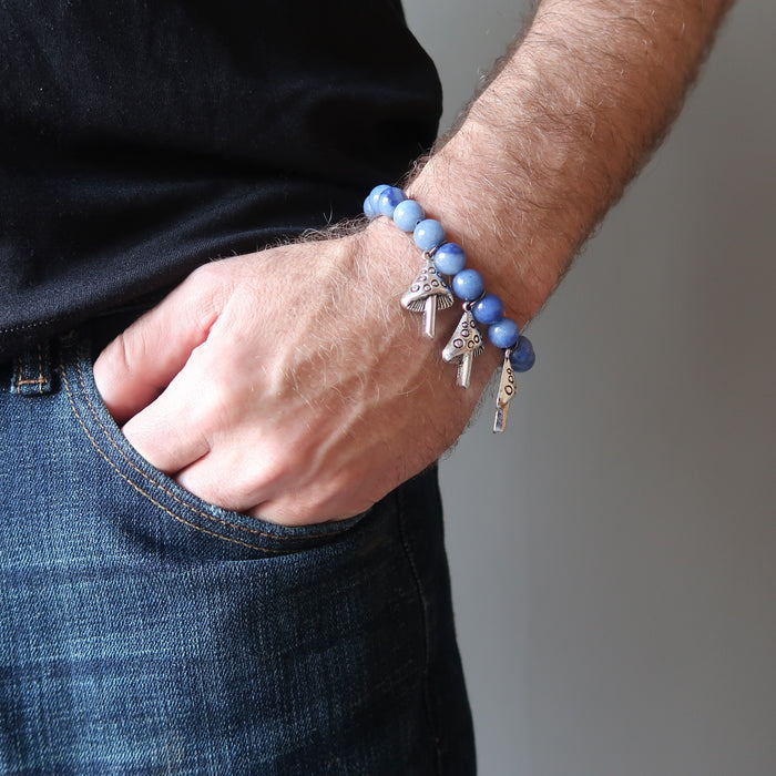 man's hand in jeans pocket wearing blue aventurine mushroom stretch bracelet