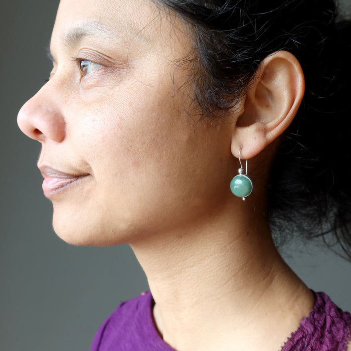 female wearing green aventurine sterling silver earrings