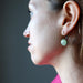 holly of satin crystals wearing green aventurine in bronze leverback earrings