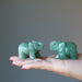 two green aventurine elephants