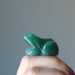 hand holding Green Aventurine Frog Statue  