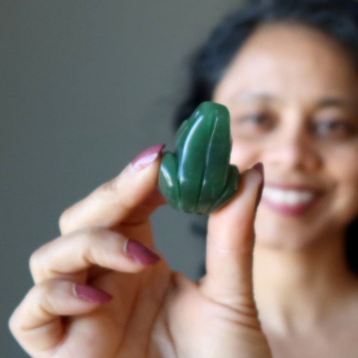 sheila of satin crystals holding Green Aventurine Frog Statue  