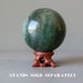 green aventurine sphere on wood display stand sold separately