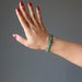 green aventurine beaded stretch bracelet on wrist