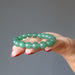 green aventurine beaded stretch bracelet in palm of hand