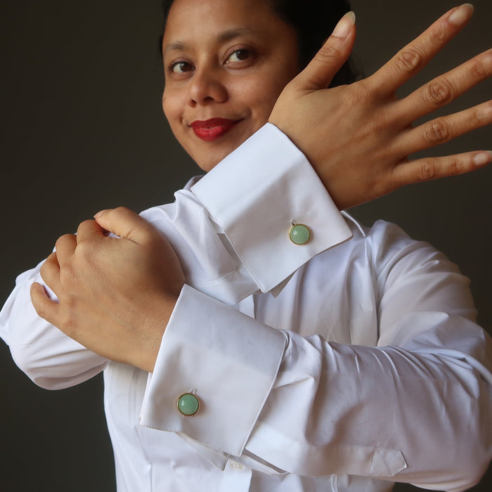 woman in white french cuff shirt wearing green aventurine cufflinks