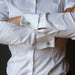 woman in white french cuff shirt wearing green aventurine cufflinks