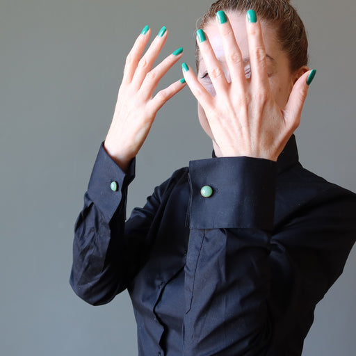 woman in black french cuff shirt wearing green aventurine cufflinks