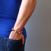 hand wearing multi colored aventurine stretch bracelet 