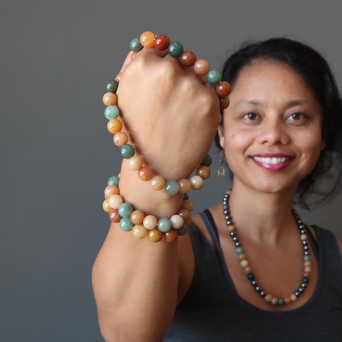 sheila of satin crystals with an armful of multi colored aventurine stretch bracelets