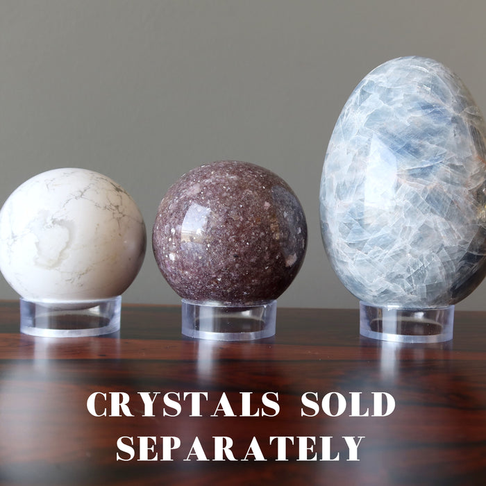 Three clear acrylic stands for displaying two crystals balls and eggs. The text says crystals sold separately.