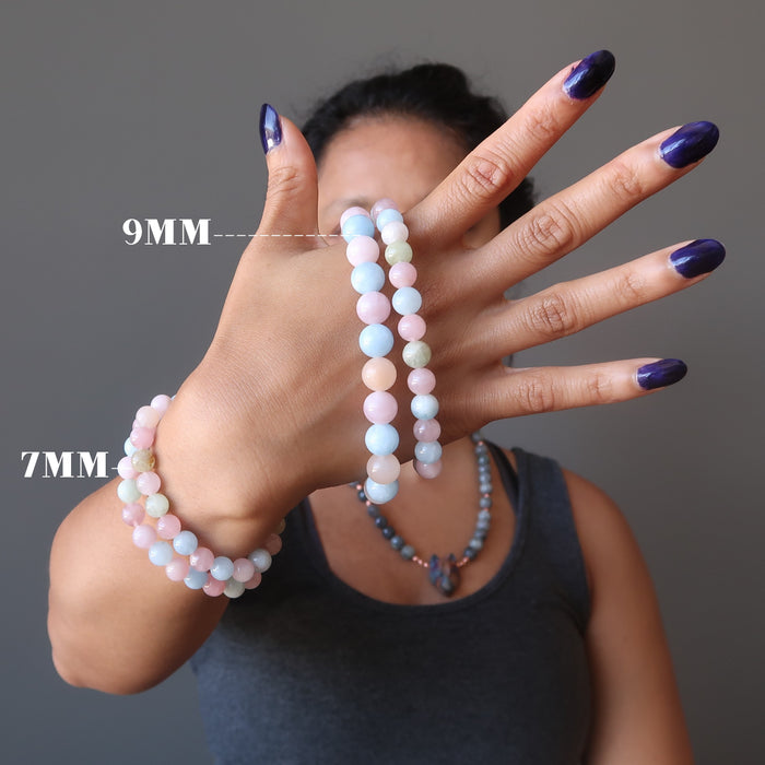 sheila of satin crystals wearing and holding woman's hand modeling multicolored beryl beaded stretch bracelets in size 7mm and 9mm