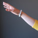 woman's hand modeling multicolored beryl beaded stretch bracelet