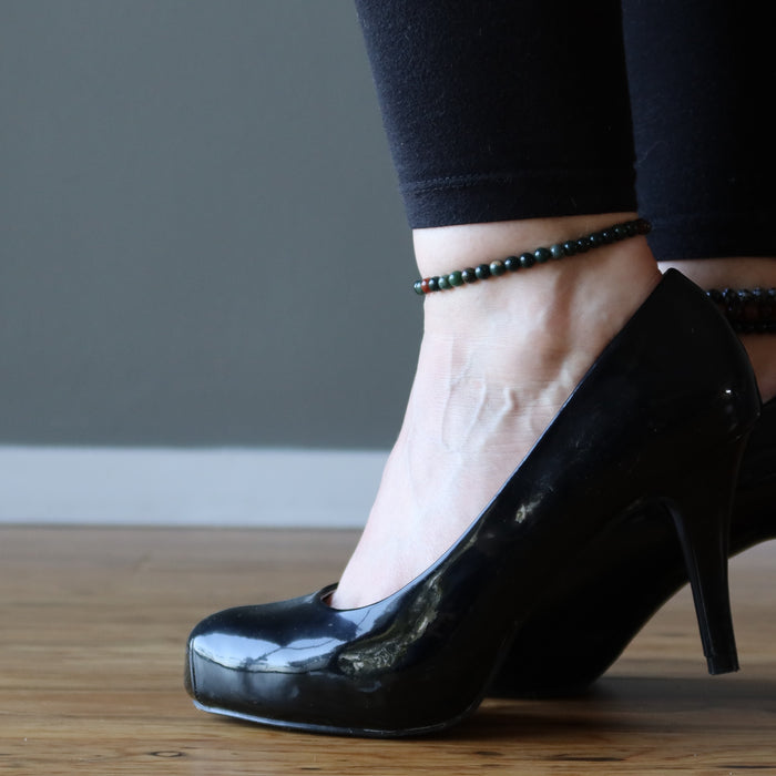 woman in high heels wearing bloodstone anklet