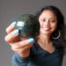sheila of satin crystals holding a bloodstone crystal sphere