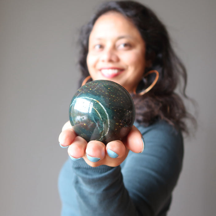 sheila of satin crystals holding bloodstone crystal sphere