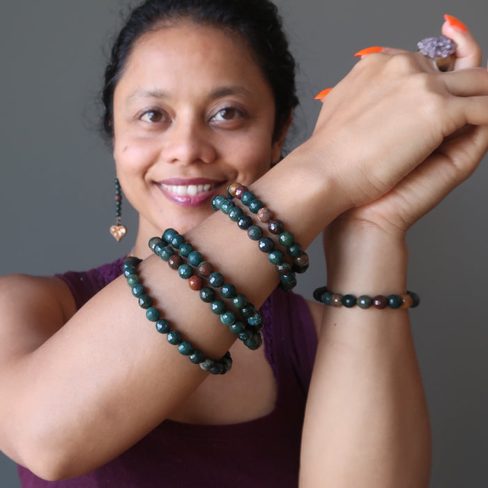 sheila of satin crystals wearing a stack of faceted bloodstone bracelets