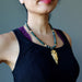 sheila of satin crystals wearing gold arrowhead bloodstone beaded necklace