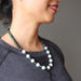 female wearing howlite and bloodstone beaded necklace