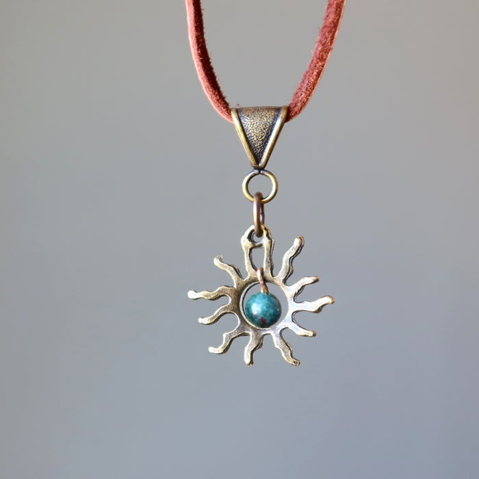 back side of bloodstone sun necklace on leather cord