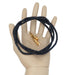 on mannequin palm displaying Bolo Cord Black Braided Leather Gold with Bola Tips Western Tie Set
