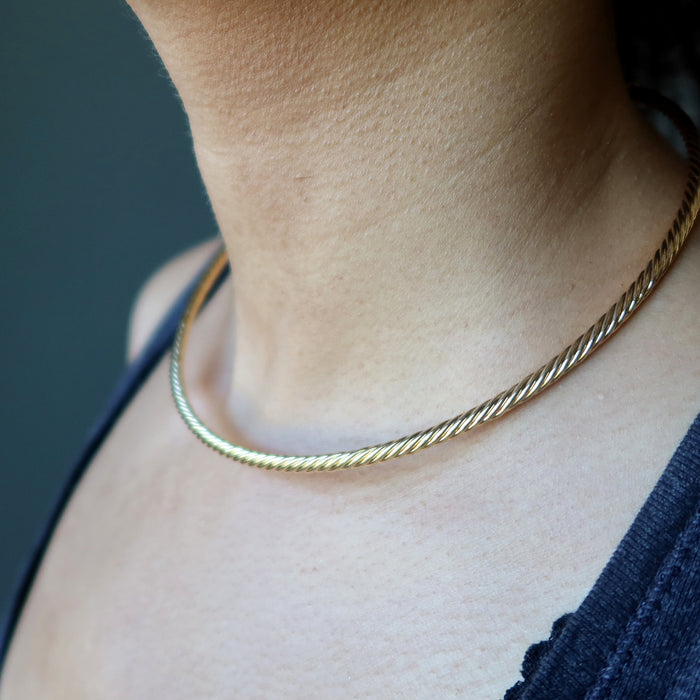 sheila of satin crystals wearing a gold plated brass twist choker necklace