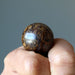 holding a Bronzite Sphere