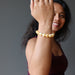 sheila of satin crystals wearing a yellow calcite beaded stretch bracelet