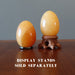 two Golden Calcite Eggs on stands