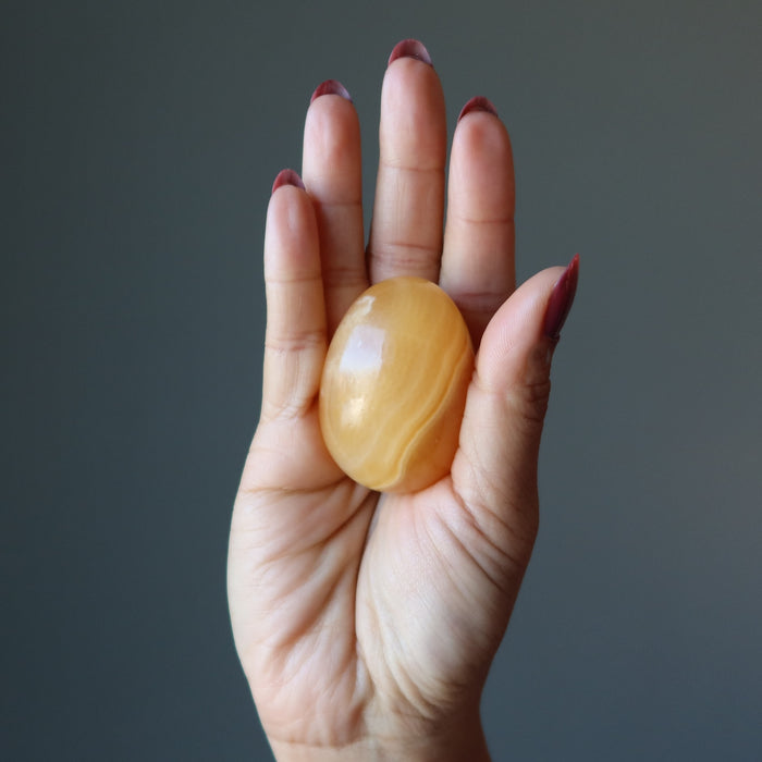 holding Golden Calcite Egg
