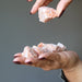 hand holding red calcite rough