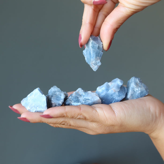 Blue Calcite Raw Gemstone Set on the palm