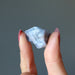 holding one Blue Calcite Raw Gemstone 