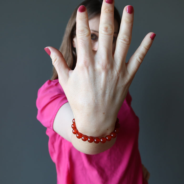 holly of satin crystals wearing carnelian stretch bracelet
