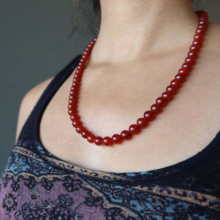 woman modeling carnelian necklace