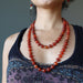 woman modeling carnelian copper beaded necklaces