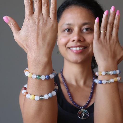 sheila of satin crystals wearing 4 snow white quartz chakra bracelets