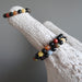 three rainbow obsidian and natural chakra stone stretch bracelets on giraffe skull