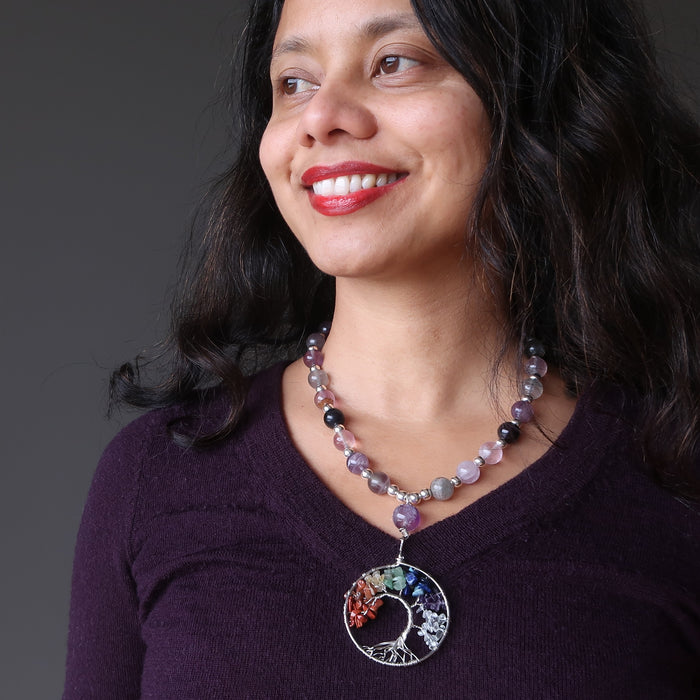 sheila of satin crystals wearing the rainbow fluorite chakra tree of life necklace