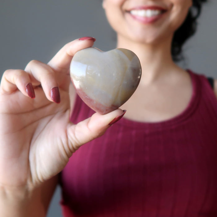 sheila of satin crystals holding Chalcedony Heart