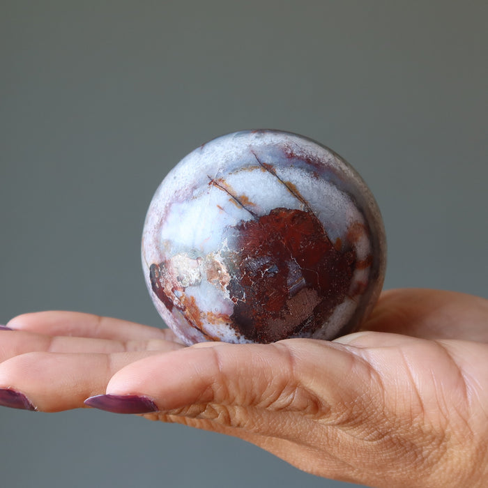 holding Blue Red Chalcedony Sphere