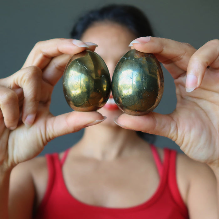 female model holding chalcopyrite eggs