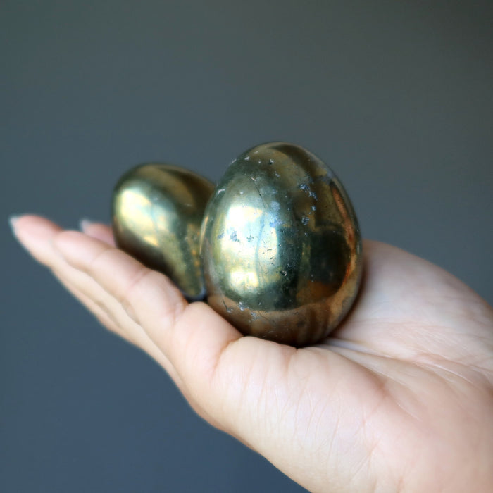 hand holding chalcopyrite eggs