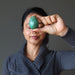 woman meditatng with chrysocolla egg