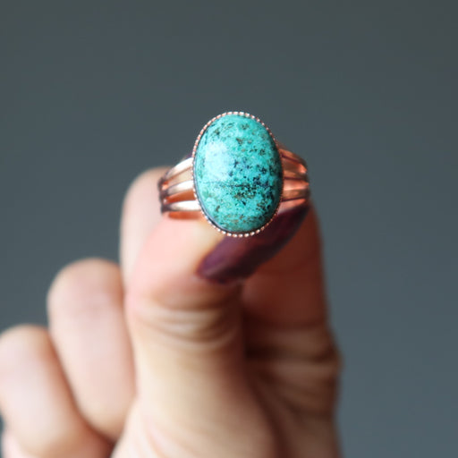 hand holding chrysocolla copper ring