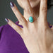 hand wearing chrysocolla copper ring