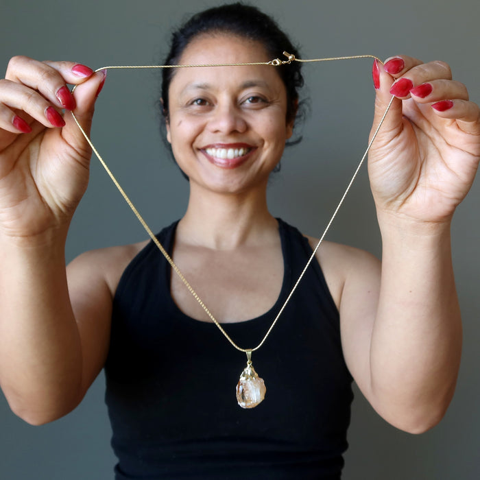 sheila of satin crystals holding citrine necklace
