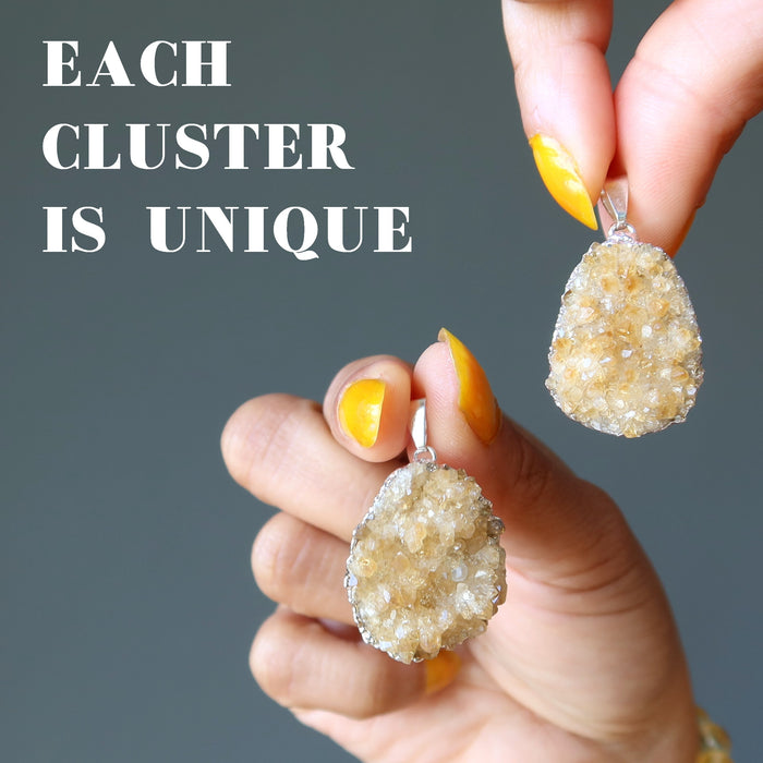 hands holding two yellow citrine cluster in silver pendants to show each is unique