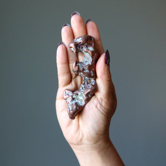 Raw Copper Gemstone on the palm